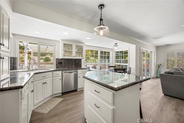 20660 Calle Feliz, Yorba Linda, CA 92886 - kitchen featuring stainless steel dishwasher, open floor plan, plenty of natural light, a center island, and crown molding