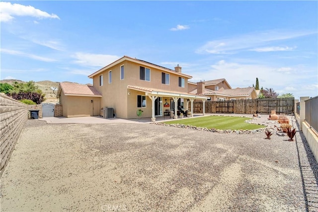 2832 Owens Way, Rosamond, CA 93560 - back of house featuring stucco siding, a patio, a fenced backyard, and a gate