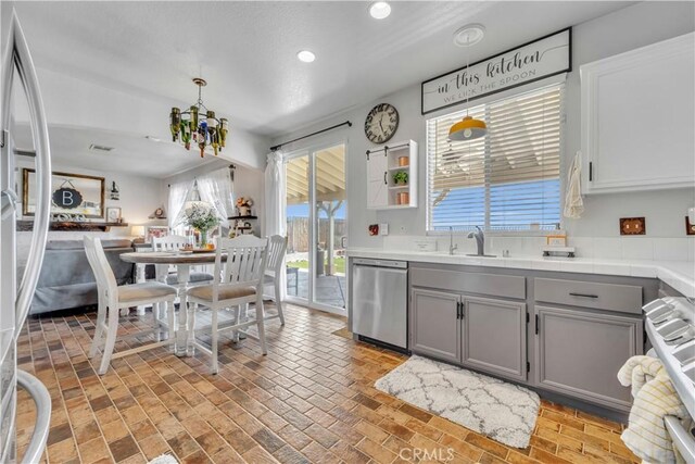 2832 Owens Way, Rosamond, CA 93560 - kitchen featuring dishwasher, gray cabinetry, a chandelier, recessed lighting, and brick patterned flooring