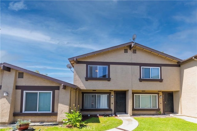 8568 Century Blvd Unit B, Paramount, CA 90723 - view of front of home featuring stucco siding and a front lawn