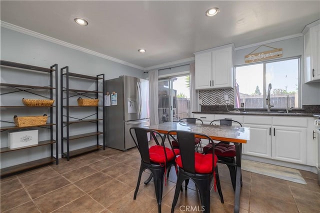 8568 Century Blvd Unit B, Paramount, CA 90723 - kitchen with stainless steel refrigerator with ice dispenser, crown molding, dark countertops, white cabinets, and a sink