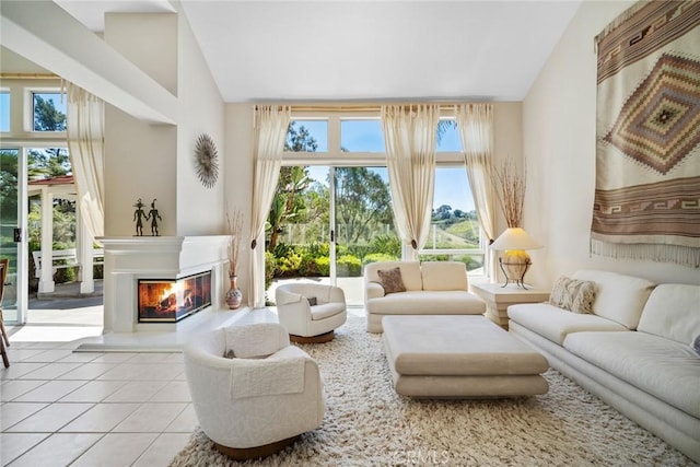 48 Siena, Laguna Niguel, CA 92677 - tiled living area featuring vaulted ceiling and a glass covered fireplace