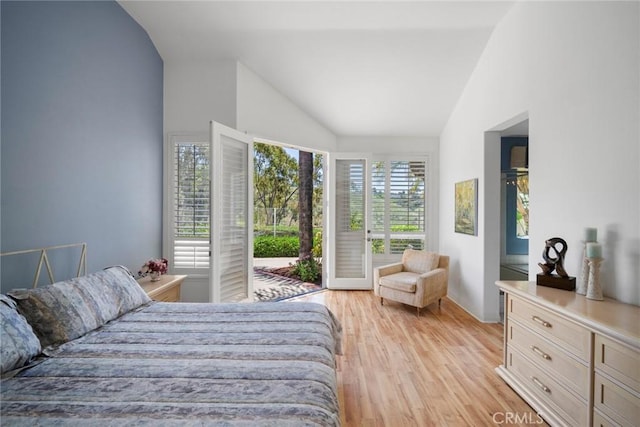 48 Siena, Laguna Niguel, CA 92677 - bedroom featuring vaulted ceiling, access to outside, light wood-style floors, and baseboards