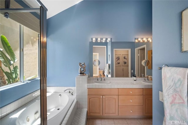 48 Siena, Laguna Niguel, CA 92677 - bathroom featuring a bath, double vanity, tile patterned flooring, and high vaulted ceiling