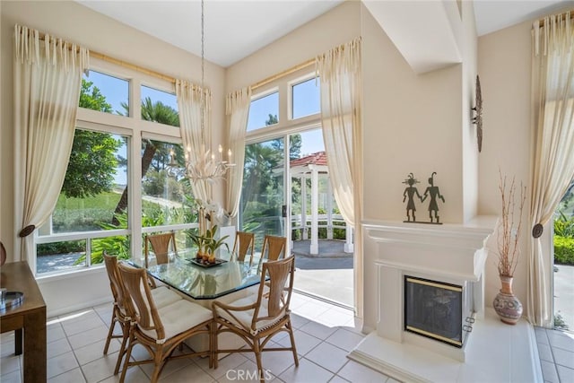 48 Siena, Laguna Niguel, CA 92677 - tiled dining space featuring a glass covered fireplace