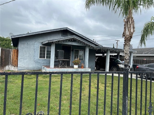 994 Magnolia Ave, San Bernardino, CA 92411 - view of front of home featuring stucco siding and a carport