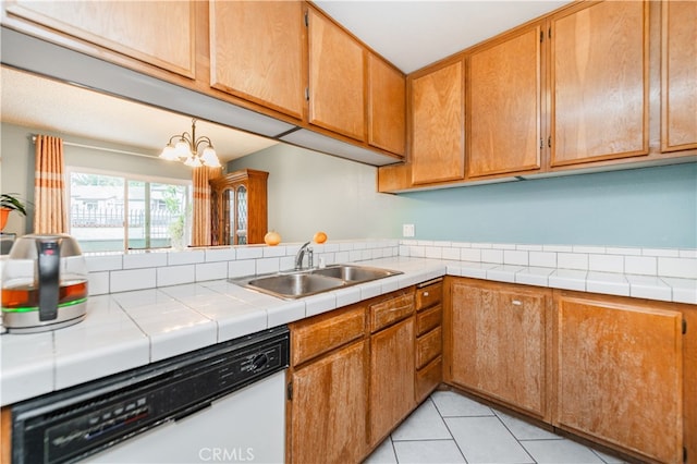 7 Town And Country Rd, Phillips Ranch, CA 91766 - kitchen featuring white dishwasher, a sink, a chandelier, light tile patterned floors, and brown cabinets