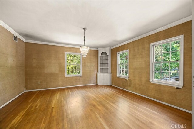 85 S San Rafael Ave, Pasadena, CA 91105 - spare room with a chandelier, baseboards, wood finished floors, and crown molding
