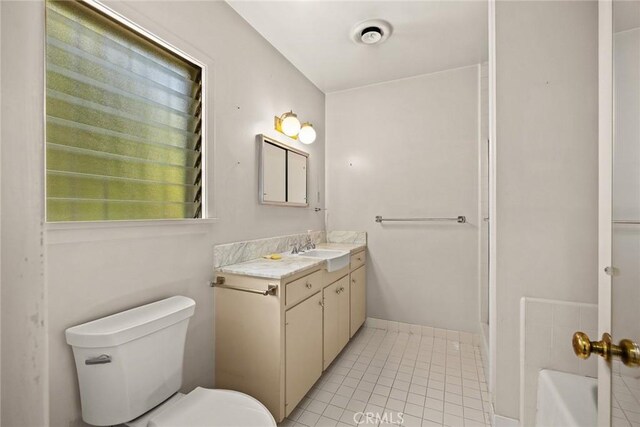 85 S San Rafael Ave, Pasadena, CA 91105 - full bathroom featuring vanity, tile patterned flooring, toilet, and a tub