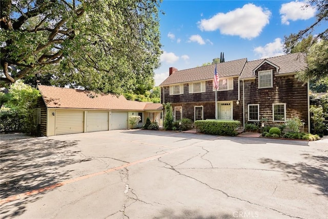 85 S San Rafael Ave, Pasadena, CA 91105 - view of front of property featuring driveway, a chimney, and a garage
