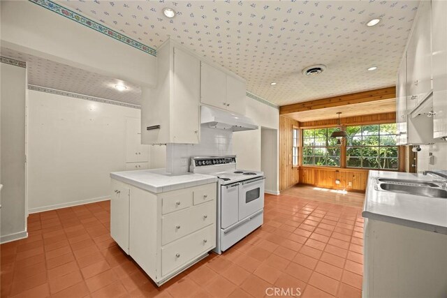 85 S San Rafael Ave, Pasadena, CA 91105 - kitchen featuring white electric stove, under cabinet range hood, a sink, baseboards, and white cabinetry