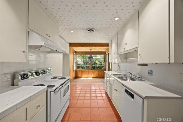 85 S San Rafael Ave, Pasadena, CA 91105 - kitchen with white appliances, under cabinet range hood, a sink, tasteful backsplash, and light tile patterned flooring