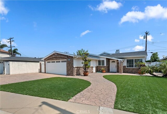 1825 Leola St, Lomita, CA 90717 - ranch-style house featuring concrete driveway, a front lawn, an attached garage, and stone siding