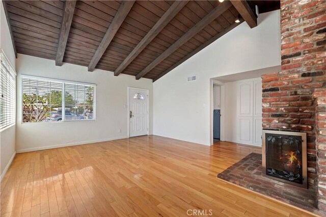 1825 Leola St, Lomita, CA 90717 - unfurnished living room with light wood-style floors, a brick fireplace, wood ceiling with exposed beams, baseboards, and high vaulted ceiling