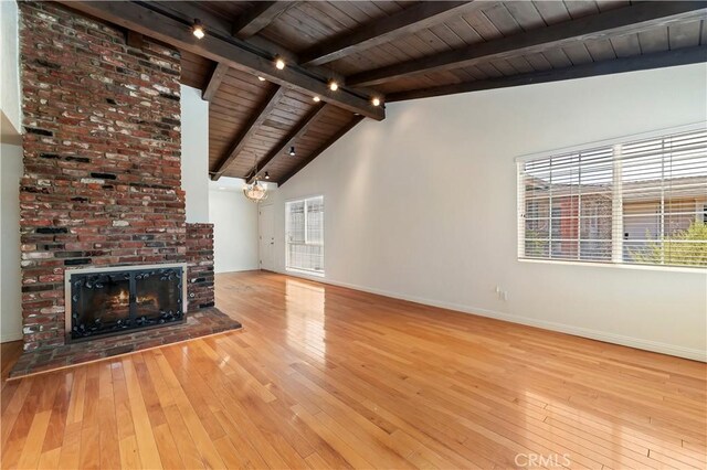 1825 Leola St, Lomita, CA 90717 - unfurnished living room with wooden ceiling, hardwood / wood-style flooring, baseboards, track lighting, and plenty of natural light