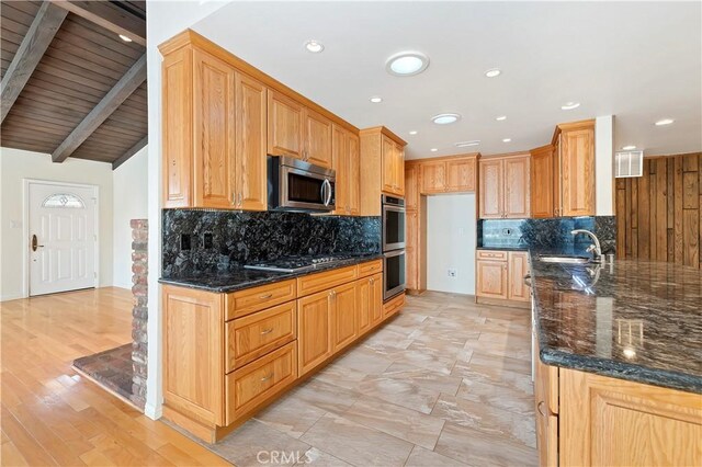 1825 Leola St, Lomita, CA 90717 - kitchen featuring stainless steel appliances, dark stone countertops, backsplash, a sink, and recessed lighting