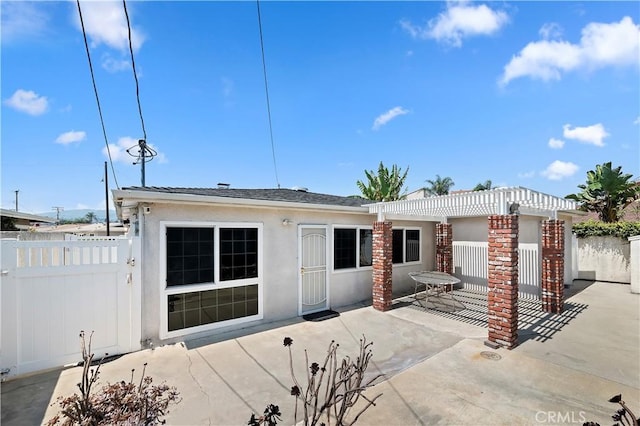 1825 Leola St, Lomita, CA 90717 - back of property with a patio, stucco siding, and a pergola