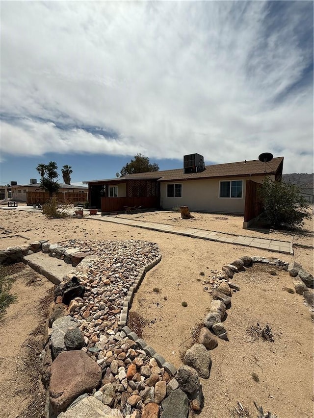 72400 El Paseo Dr Unit 29, Palms, CA 92277 - rear view of house with cooling unit