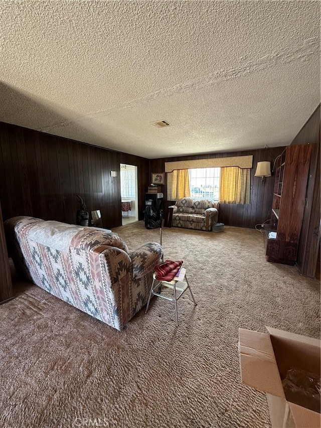 72400 El Paseo Dr Unit 29, Palms, CA 92277 - carpeted bedroom with multiple windows, wood walls, and a textured ceiling