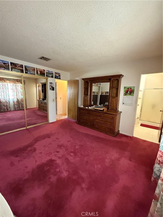 72400 El Paseo Dr Unit 29, Palms, CA 92277 - living room with a textured ceiling and carpet