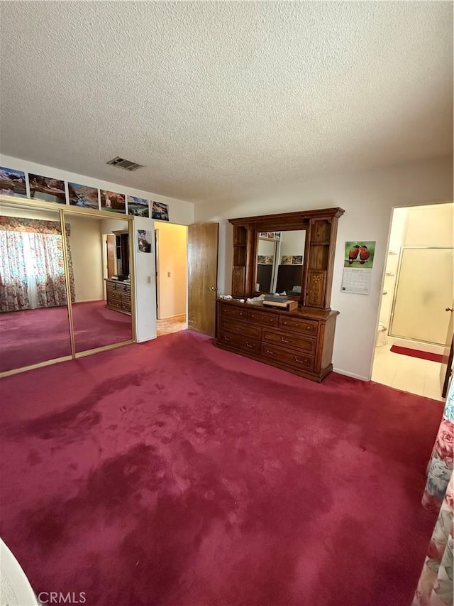 72400 El Paseo Dr Unit 29, Palms, CA 92277 - carpeted living room featuring a textured ceiling