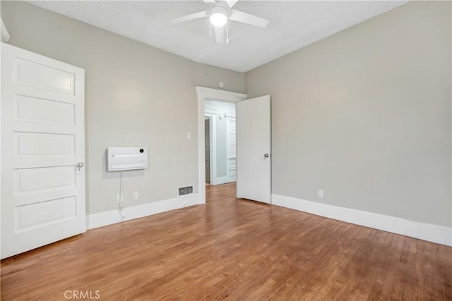 142 S Ardmore Ave, Los Angeles, CA 90004 - unfurnished bedroom with baseboards, wood finished floors, and a ceiling fan