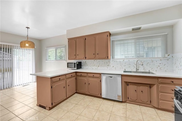 142 S Ardmore Ave, Los Angeles, CA 90004 - kitchen with stainless steel appliances, a sink, a peninsula, and backsplash