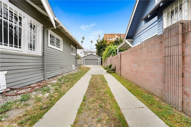 142 S Ardmore Ave, Los Angeles, CA 90004 - view of yard with concrete driveway and a detached garage
