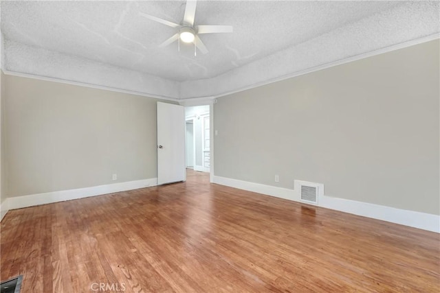 142 S Ardmore Ave, Los Angeles, CA 90004 - unfurnished room featuring a textured ceiling, wood finished floors, a ceiling fan, crown molding, and baseboards