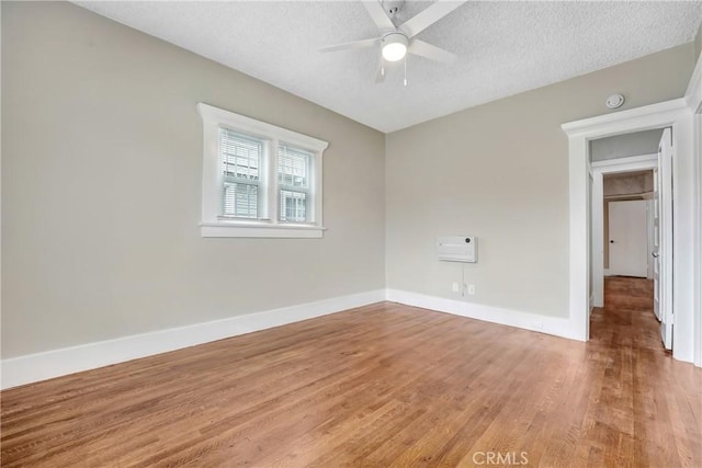 142 S Ardmore Ave, Los Angeles, CA 90004 - unfurnished room featuring light wood finished floors, a ceiling fan, baseboards, a textured ceiling, and a smoke detector