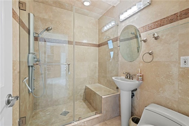 645 Glenmore Blvd, Glendale, CA 91206 - full bathroom with tile walls, a stall shower, and toilet