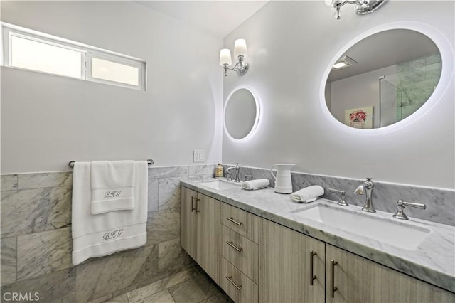 645 Glenmore Blvd, Glendale, CA 91206 - bathroom featuring double vanity, a wainscoted wall, and tile walls