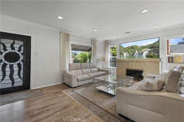 645 Glenmore Blvd, Glendale, CA 91206 - living room with crown molding, healthy amount of natural light, wood finished floors, a premium fireplace, and baseboards
