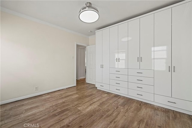 645 Glenmore Blvd, Glendale, CA 91206 - unfurnished bedroom with ornamental molding, wood finished floors, and baseboards