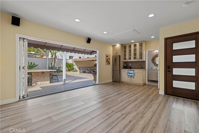 645 Glenmore Blvd, Glendale, CA 91206 - entryway with light wood-style floors, baseboards, recessed lighting, and wine cooler