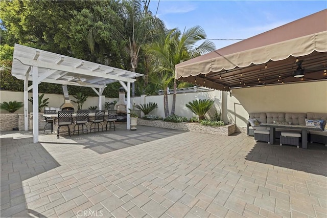 645 Glenmore Blvd, Glendale, CA 91206 - fenced backyard featuring a patio, a pergola, and an outdoor hangout area
