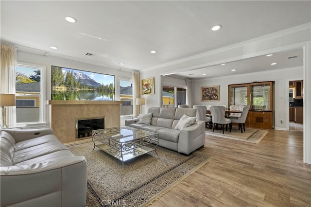 645 Glenmore Blvd, Glendale, CA 91206 - living area featuring crown molding, wood finished floors, recessed lighting, a fireplace, and baseboards