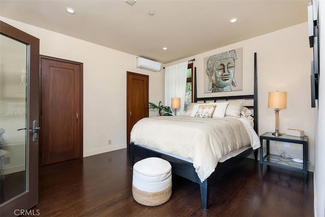 32661 Caribbean Dr, Dana Point, CA 92629 - bedroom featuring an AC wall unit, dark wood-style floors, and recessed lighting