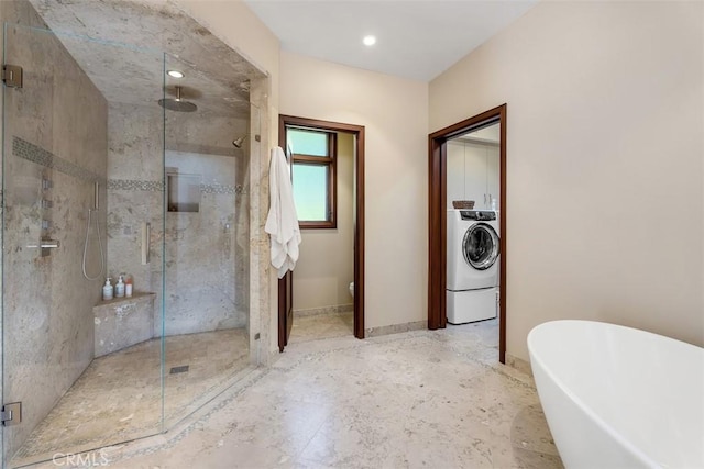 32661 Caribbean Dr, Dana Point, CA 92629 - full bathroom with washer / dryer, a shower stall, and a freestanding bath
