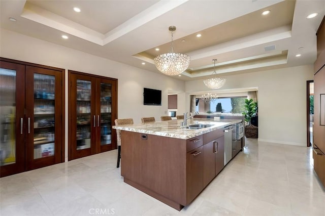 32661 Caribbean Dr, Dana Point, CA 92629 - kitchen with a raised ceiling, french doors, a chandelier, a large island, and dishwasher