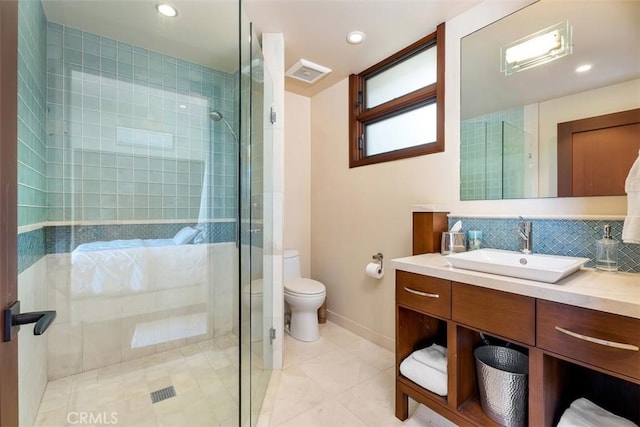 32661 Caribbean Dr, Dana Point, CA 92629 - full bathroom featuring vanity, tiled shower, decorative backsplash, tile patterned flooring, and recessed lighting