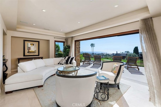 32661 Caribbean Dr, Dana Point, CA 92629 - living room featuring a tray ceiling, recessed lighting, and light tile patterned floors
