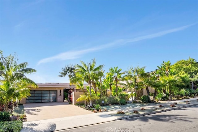 32661 Caribbean Dr, Dana Point, CA 92629 - view of front of house featuring concrete driveway, an attached garage, and stucco siding