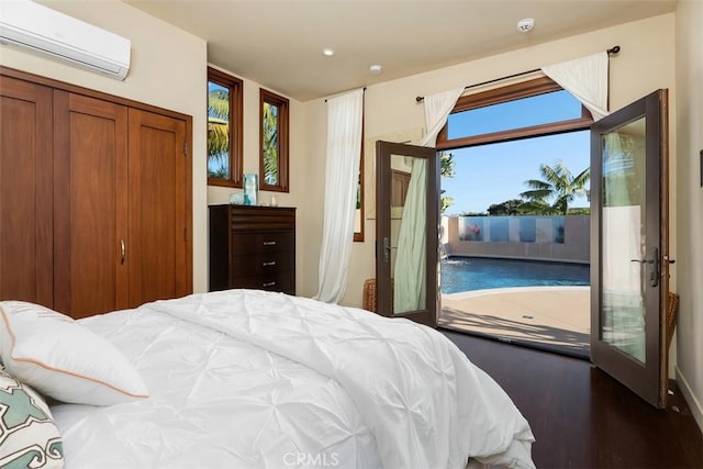 32661 Caribbean Dr, Dana Point, CA 92629 - bedroom featuring an AC wall unit, access to outside, wood finished floors, and recessed lighting