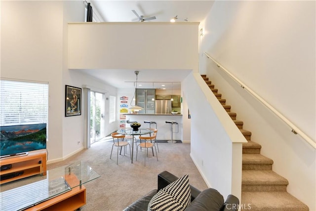 796 Via Colinas, Thousand Oaks, CA 91362 - living area with a high ceiling, stairway, carpet flooring, ceiling fan, and baseboards