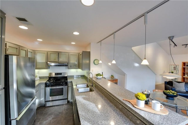 796 Via Colinas, Thousand Oaks, CA 91362 - kitchen with stainless steel appliances, a sink, under cabinet range hood, a peninsula, and decorative light fixtures