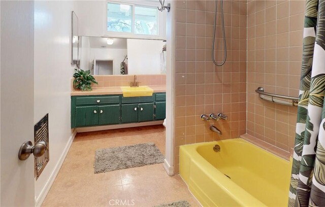 16733 Archwood St, Van Nuys, CA 91406 - bathroom with baseboards, vanity, shower / bathtub combination with curtain, tile patterned flooring, and decorative backsplash