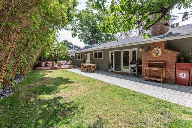 16733 Archwood St, Van Nuys, CA 91406 - view of green lawn featuring a patio, a deck, and french doors