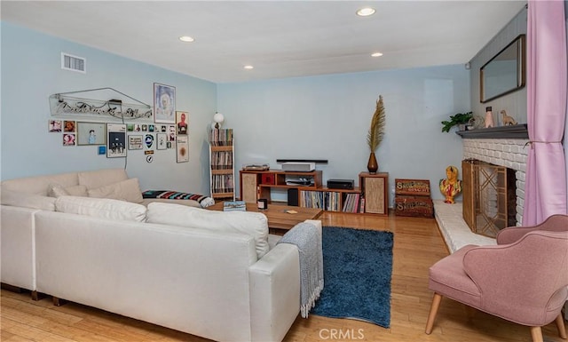 16733 Archwood St, Van Nuys, CA 91406 - living area with light wood finished floors, a fireplace, and recessed lighting