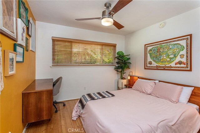 16733 Archwood St, Van Nuys, CA 91406 - bedroom with wood finished floors, a desk, and ceiling fan